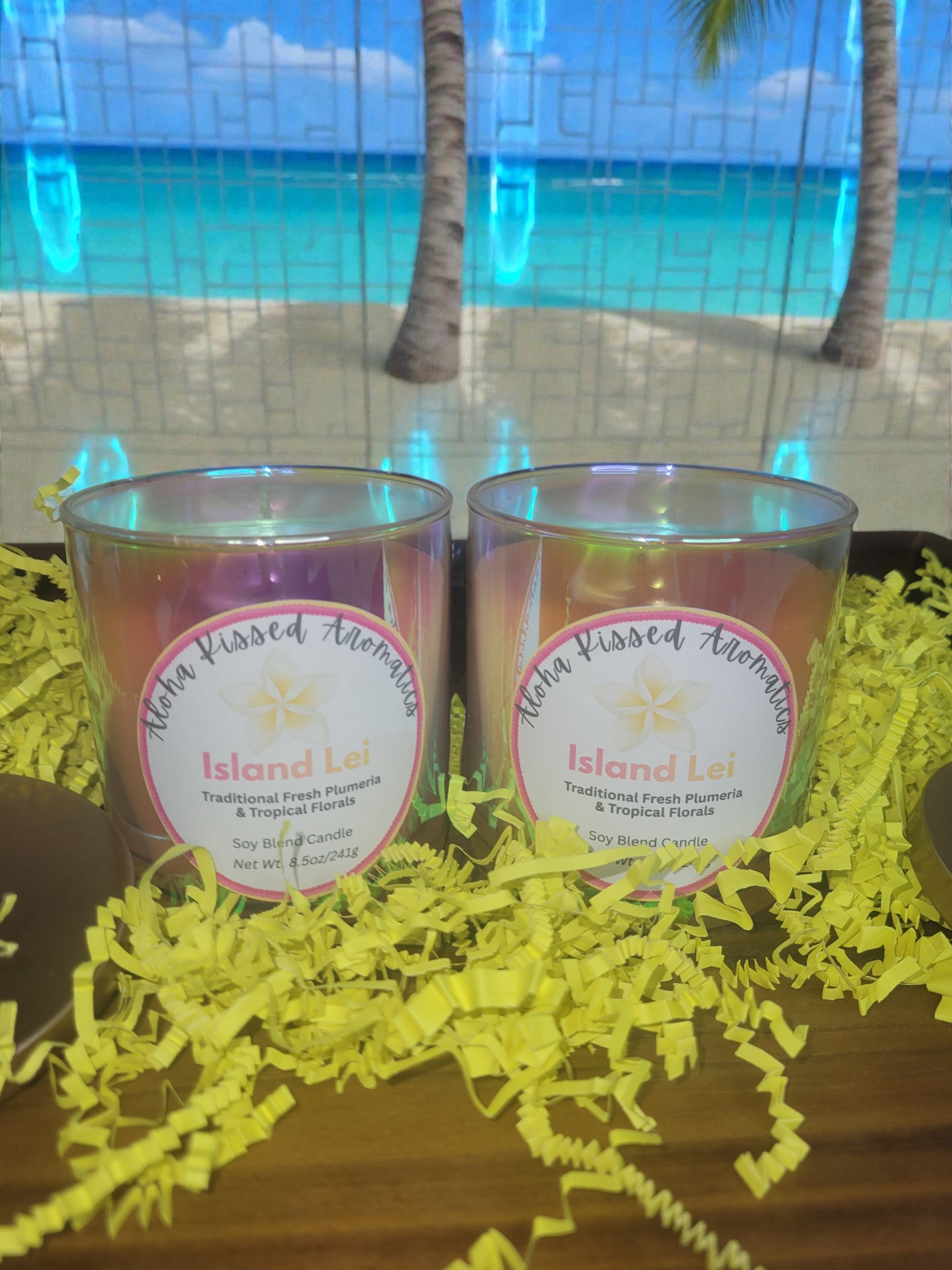 Island Lei floral candle in iridescent Prism glass featuring tropical hibiscus and plumeria.