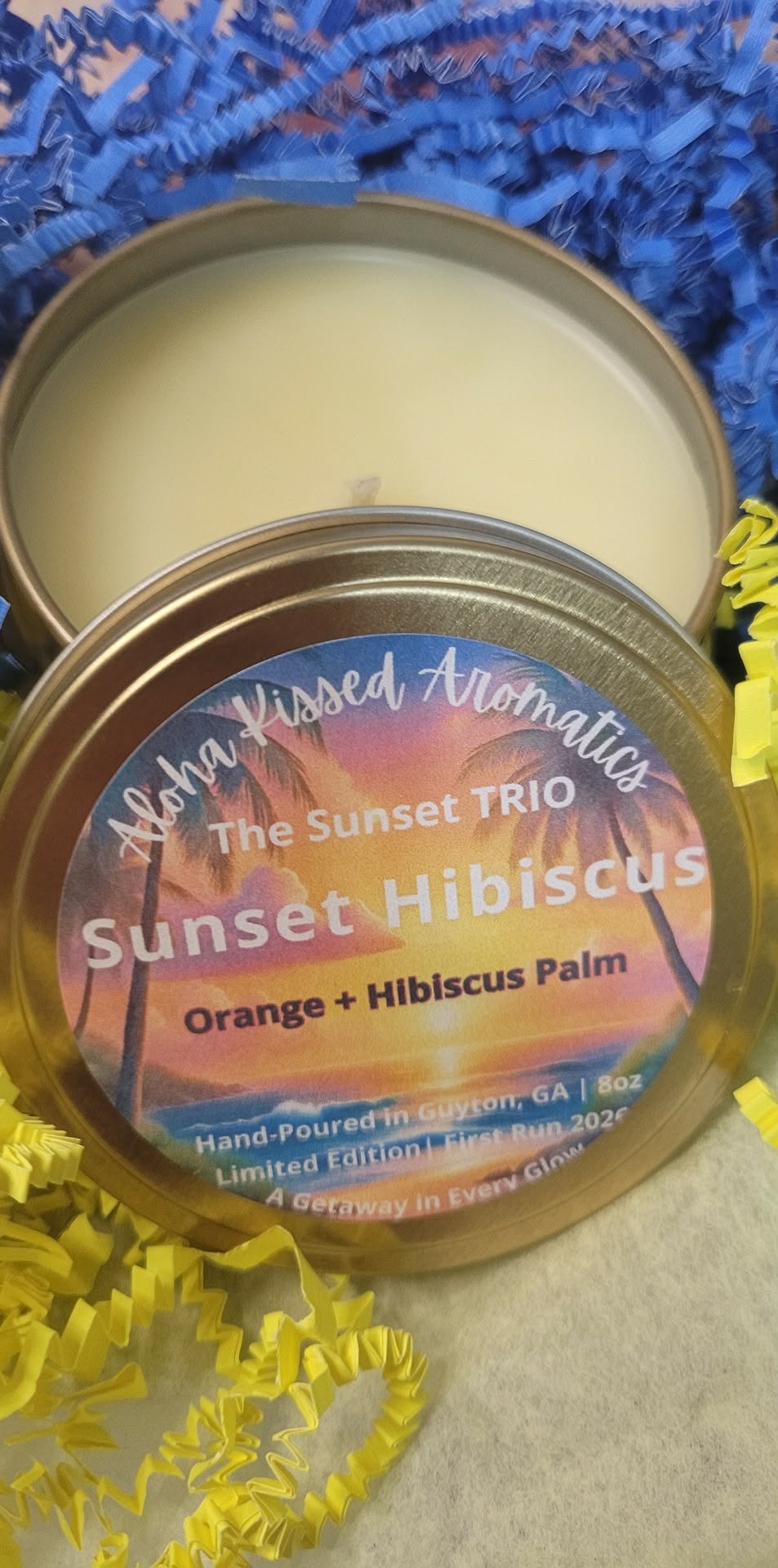 Sunset Hibiscus floral candle in 8oz gold tin with soft tropical blooms and evening breeze notes.